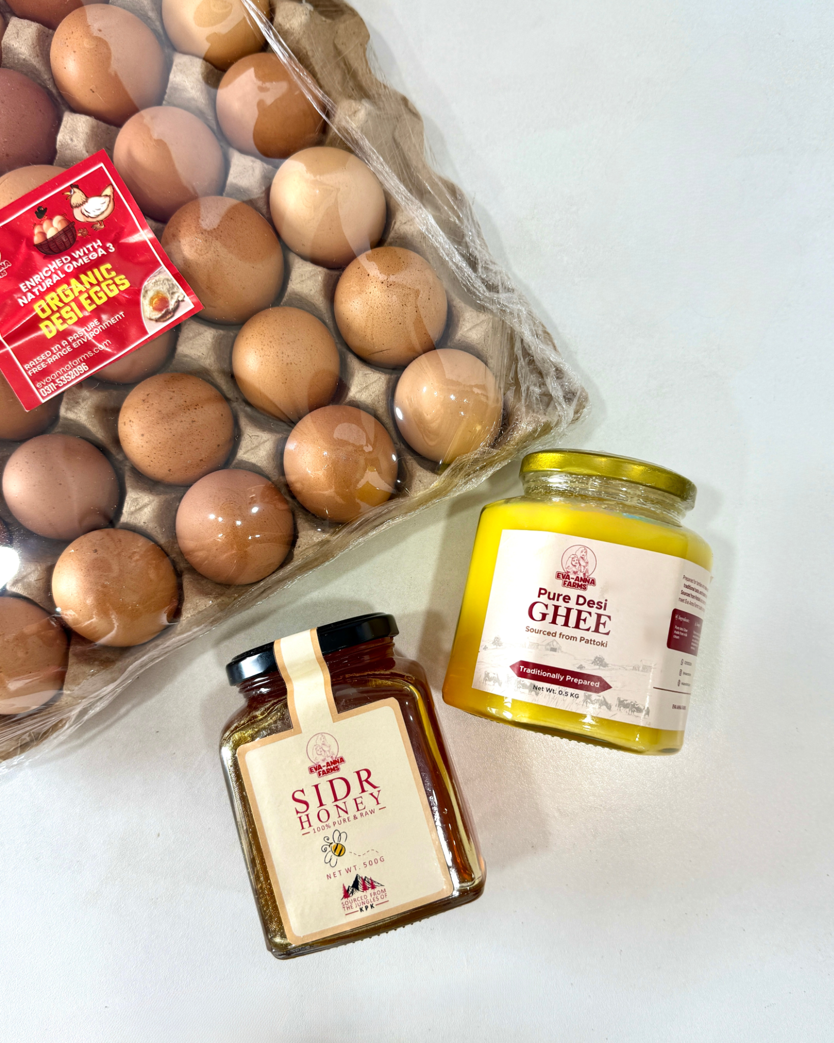 Eva Anna Farms Desi Eggs, Desi Ghee and Sidr Honey Bundle on a white background